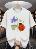 Men's T-Shirt Whimsical Garden Flower With Leaves Beside A Playful Red Ladybug