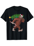 Men's T-Shirt Festive Holiday Cheerful Bigfoot Carrying Decorated Christmas Tree