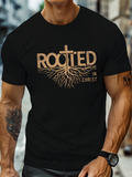 Men's T-Shirt Rooted In Christ Tree Roots Extending Beneath Golden Lettering Cross