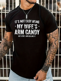 Men's T-Shirt Its Not Easy Being My Wifes Arm Candy But Here I Am Killing It Bold Lettering Statement Black T Shirt
