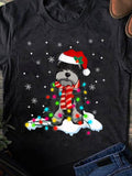 Men's T-Shirt Festive Snowy Night With Dog Wearing Holiday Hat Wrapped In Colorful Lights