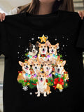 Women's T-Shirt Festive Christmas Garland With Colorful Stars And Playful Corgi Dogs