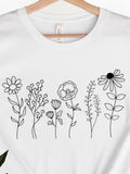 Men's T-Shirt Whimsical Delicate Linework Flowers Blooming Across The White Cotton Tee