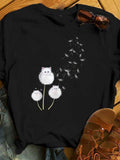 Women's T-Shirt Whimsical Dandelion Fluff With Playful White Cat On Black Shirt