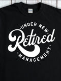 Men's T-Shirt Under New Management Playful Script With Bold Round Lettering Retired