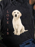 Men's T-Shirt Love Is Cream Colored Puppy Sitting Under Soft Lighting Dog