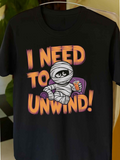 Men's T-Shirt I Need To Unwind Cartoon Mummy On Sofa Holding Popcorn
