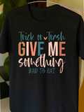 Men's T-Shirt Trick Or Trash Give Me Something Bad To Eat Handwritten Playful Letters Over Black T Shirt