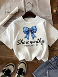 Men's T-Shirt She Is Worthy With Shimmering Blue Bow Under Soft Light