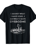 Men's T-Shirt I Am Not What I Have Done I Am What I Have Overcome With Fallen Cross Among Wildflowers And Ground