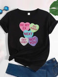 Women's T-Shirt Colorful Heart Shaped Candy With Playful Sassy Quotes Centered On Black Shirt