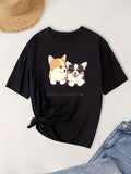 Women's T-Shirt Two Happy Cartoon Puppies Smiling With Soft Fur On Playful Black T Shirt