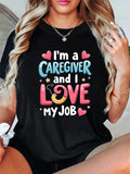 Women's T-Shirt Im A Caregiver And I Love My Job Colorful Cartoon Letters With Small Hearts