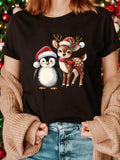 Women's T-Shirt Holiday Spirit With Penguin Wearing Red Santa Hat And Christmas Reindeer