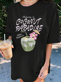 Women's T-Shirt Relaxing In Coconut Paradise With Pink Flowers And Fresh Green Coconut