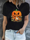 Women's T-Shirt Autumn Leaves With Scary Carved Pumpkin Resting On Rocks Pumpkin