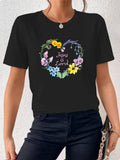 Women's T-Shirt Jesus Is Loved Colorful Floral Wreath With Garden Blooms And Green Leaves Heart