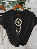Women's T-Shirt Golden Vintage Jewel Frame With Hanging Pearl Chains On Black Shirt