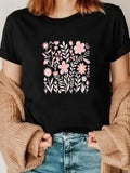 Women's T-Shirt Soft Pink Blossoms Among Lush Leaves Delicate Spring Garden Flower