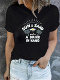 Women's T-Shirt Sun And Sand With A Drink In Hand Under Shining Sun Palms On Black T Shirt
