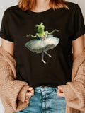 Women's T-Shirt Graceful Ballerina Frog With Tutu Among Flowing Movements Dancing Stage Frog