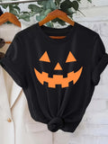Women's T-Shirt Smiling Orange Jack O Lantern Face Under Creeping Vines On Black T Shirt
