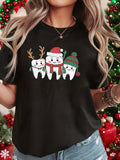 Women's T-Shirt Whimsical Winter Holiday Smiling Cartoon Teeth Trio With Festive Decorations
