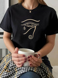 Women's T-Shirt Ancient Gold Lines On Black Cotton Depicting Egyptian Symbolic Eye