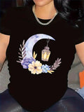 Women's T-Shirt Vintage Lantern Hanging Below Crescent Moon With Blooming Pastel Wildflowers