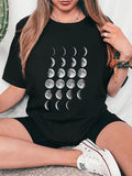 Women's T-Shirt Lunar Phases In Shifting Tones Among Expansive Twilight Black Shirt Moon