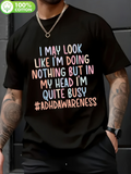 Men's T-Shirt I May Look Like I Am Doing Nothing But In My Head I Am Quite Busy Hashtag ADHD Awareness With Gradient Pastel Letters Over Black Fabric T Shirt