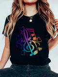 Women's T-Shirt Colorful Musical Notes With Rainbow Hearts Scattered Across Black Shirt