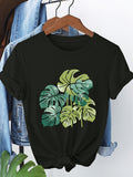 Women's T-Shirt Tropical Leaves With Watercolor Gradients Arranged On Front Monstera Leaf