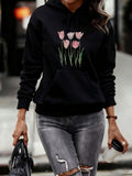 Women's Hoodie Delicate Pink Tulip Flowers With Lush Green Stems On Black Hoodie