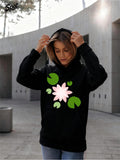 Women's Hoodie Radiant Pink Blossom Surrounded By Lush Green Leaves Flower