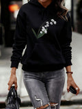 Women's Hoodie Delicate Lily Of The Valley With Lush Green Leaves On Black Hoodie