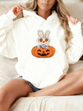Women's Hoodie Adorable Bunny Sitting Playfully Among Carved Halloween Pumpkin
