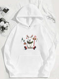 Women's Hoodie Playful Christmas Scene With Snow Covered Trees And Festive Holiday Reindeer