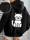 Women's Hoodie Minimalist White Cat Sitting Calmly On Black Hoodie