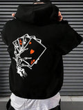 Men's Hoodie Mysterious Skeletal Hand Holding Playing Cards Under Shadowy Night Sky