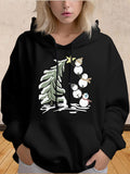 Women's Hoodie Stacked Snowmen Wearing Scarves Beside Decorated Christmas Pine Tree