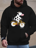 Men's Hoodie Playful Cartoon Cow Riding Yellow Bicycle Under Bright Daylight