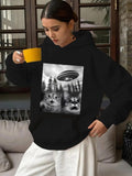 Women's Hoodie Surreal Grayscale Forest Scene Featuring Hovering Flying Saucer Above Surprised Cat