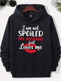 Men's Hoodie I Am Not Spoiled My Husband Just Loves Me Vibrant Red Lipstick Mark Style Set Against Dark Fabric Background Lips